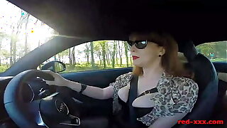 British mature Red thumbs her cunt in the car again